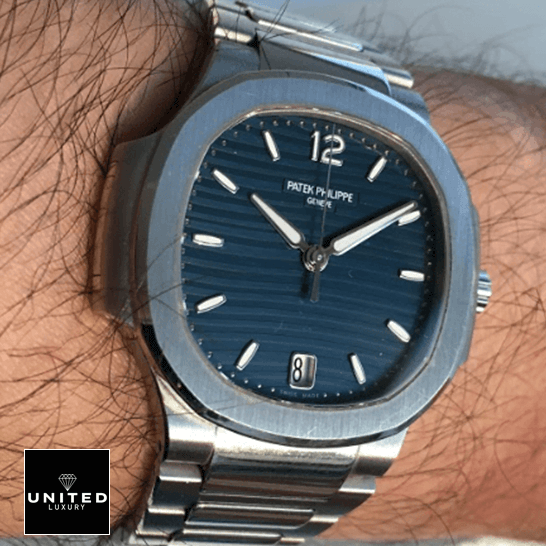 Patek Philippe Nautilus 7118/1A Ladies Perfect Duplicate 1:1 patekphilippe nautilus 71181A 001 replica hand Patek Philippe Nautilus 71181A-001 Blue Dial Geneve Replica on the man wrist