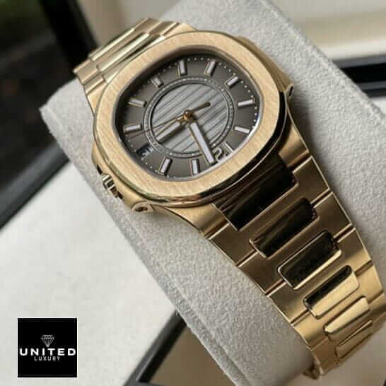 Patek Philippe Nautilus 7011/1R "Rose Gold" Exact Duplicate Quality patek 7011 1r 010 replica Patek Philippe Black Dial Gold Bracelet Replica in the stand