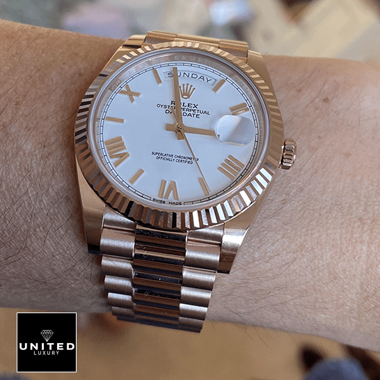 Rolex Day-Date President Rose Gold Roman Dial 118235F-0024 Ultra Fine Replica rolex day date 118235f 0024 replica romannumerals Rolex Day-Date President 118235f-0024 Rose Gold Fluted Bezel Replica on his arm