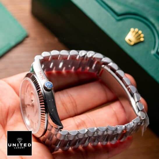 Rolex 228239-0033 replica side view on the hand and rolex logo