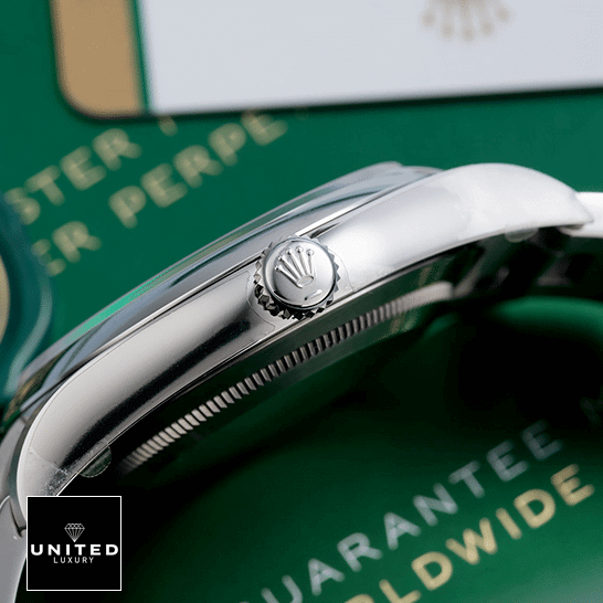 Rolex Oyster Perpetual 114300 "Steel Case" Super Clone Quality Rolex Datejust Perpetual 114300 Stainless Steel Case & Crown Pusher Replica Right Side on the table