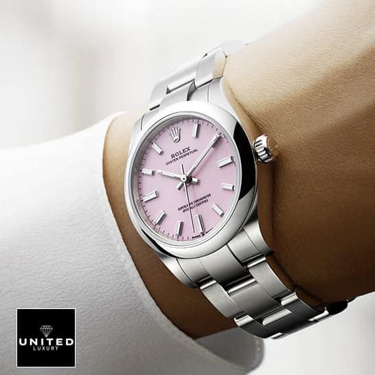 Rolex Oyster Perpetual 124300 "Candy Pink" Collector’s Clone 1:1 rolex oyster perpetual 126000 replica 4 Rolex Oyster Perpetual 124300 Pink Dial Oyster Replica on his arm